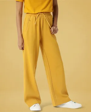 Rareism Women Capsule Mustard Cotton Blend Fabric Relaxed Fit Solid Mid Rise Ankle Length Track Pant