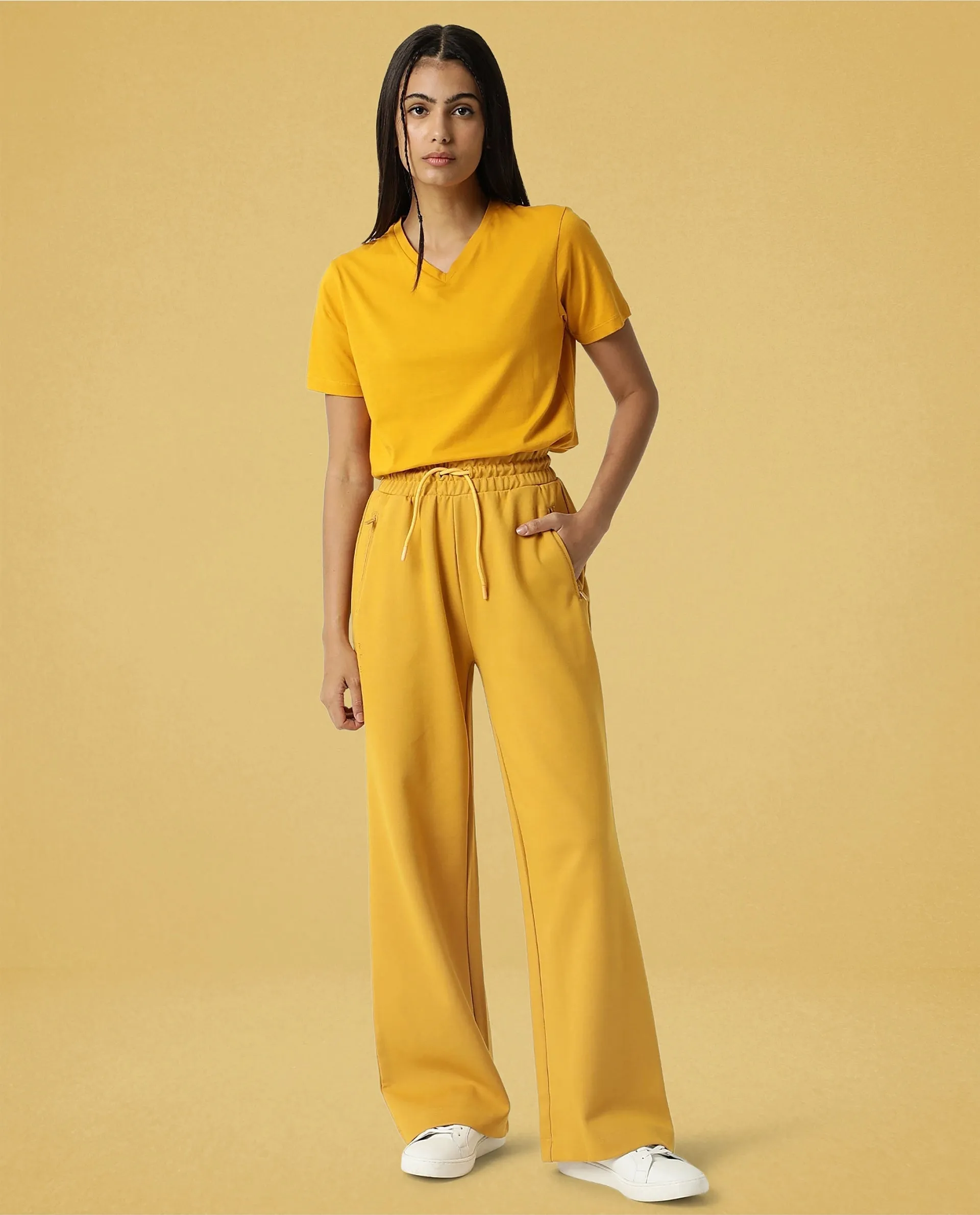 Rareism Women Capsule Mustard Cotton Blend Fabric Relaxed Fit Solid Mid Rise Ankle Length Track Pant